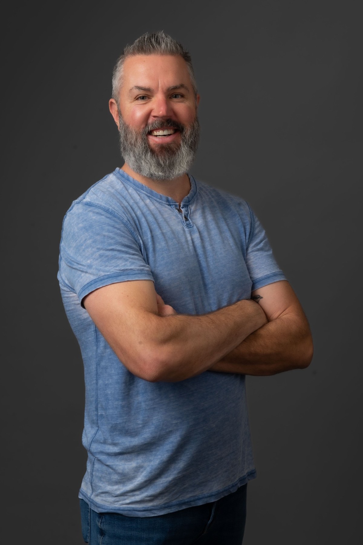 Matthew Couch smiling in a casual blue shirt