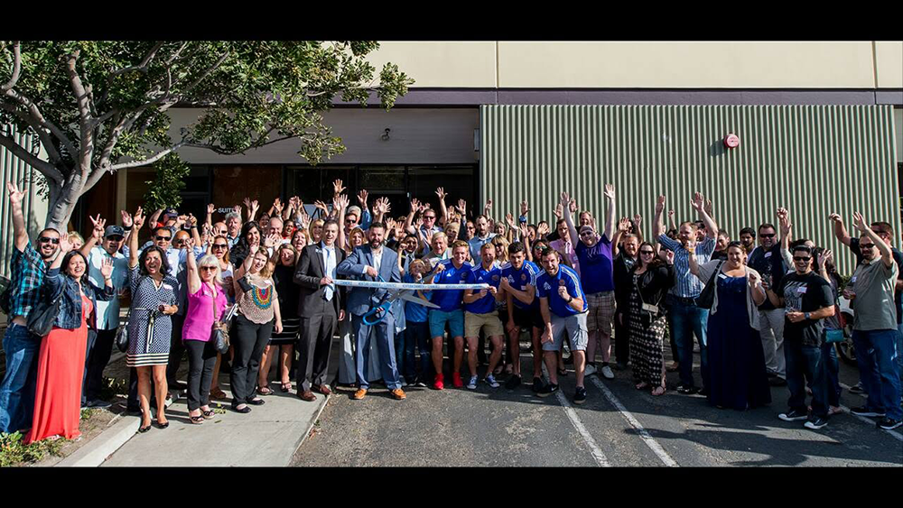 Group gathered for a MortgageCouch ribbon cutting in 2016